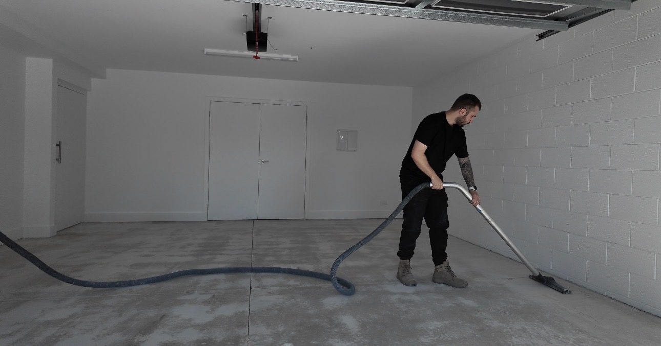 Cleaning and preparing sound concrete with dust extraction on a Melbourne concrete repair job