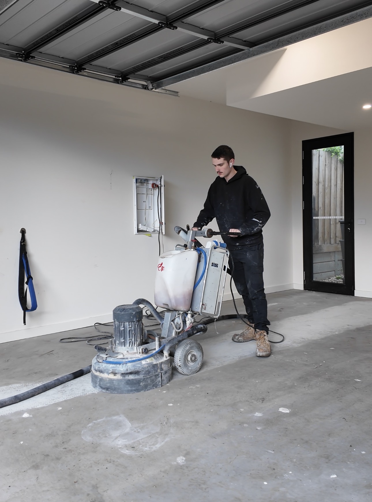 Concrete To Style grinding back damaged concrete during a Melbourne slab repair